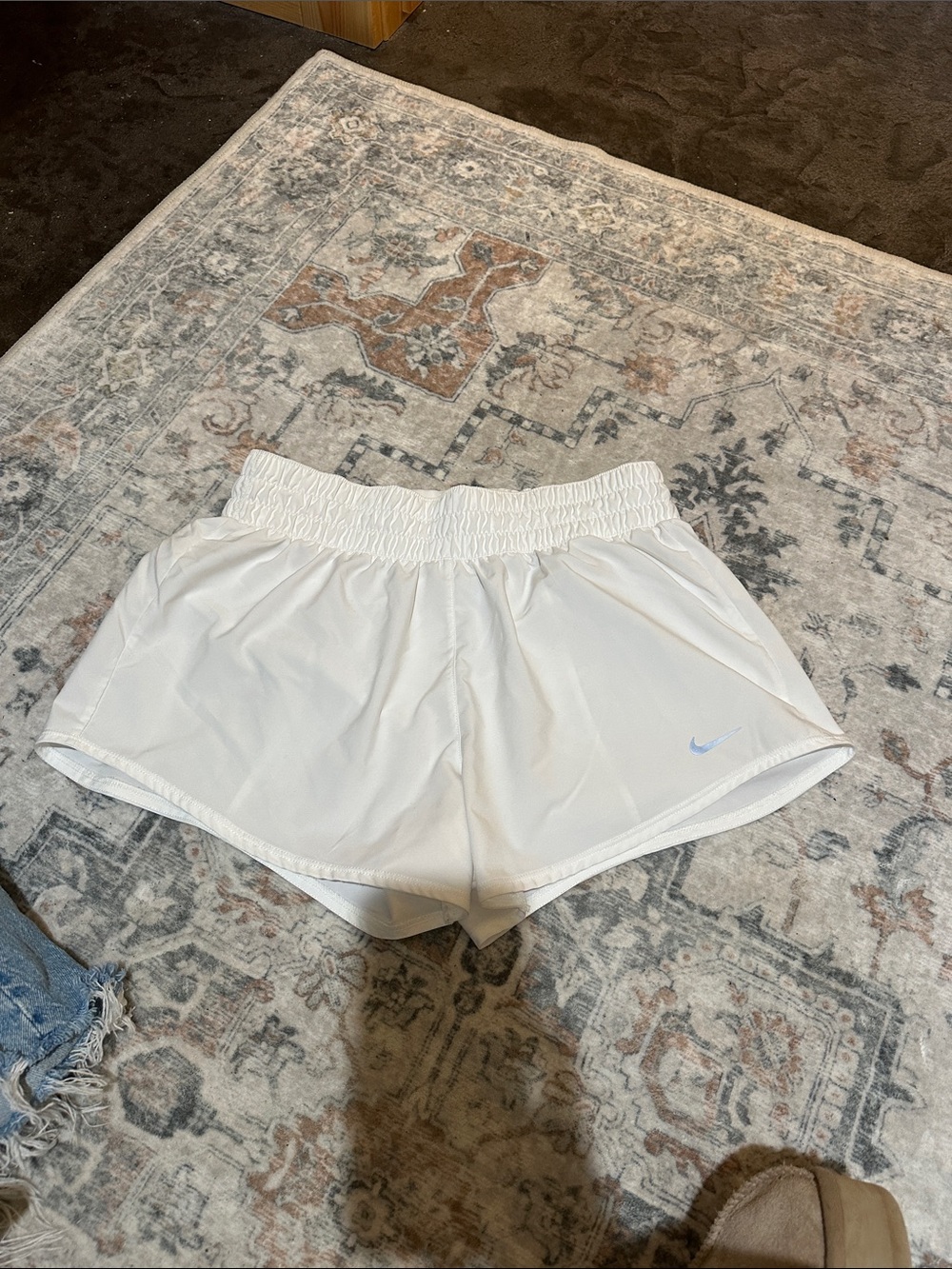 Nike White Elastic-Waist Athletic Shorts with Light Blue Swoosh